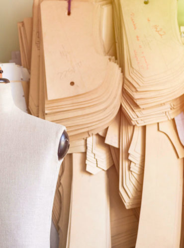 Mannequin,In,Bespoke,Tailor,Studio,Against,Cardboard,Sewing,Patterns.